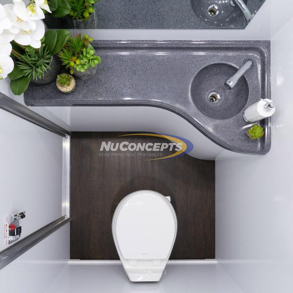 The easy to clean curved countertop with molded-in sink and upgraded faucet provides plenty of room to move and a stylish area for flowers or other decorations.