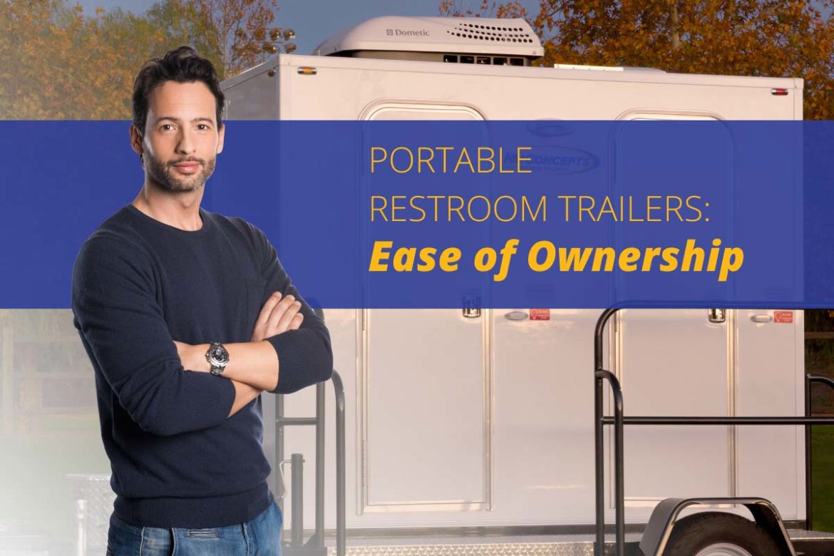 Person standing outside of a luxury restroom trailer for sale